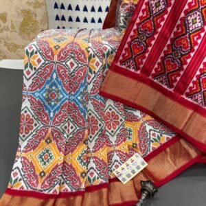 White ikat silk saree with red tissue border and Patola design