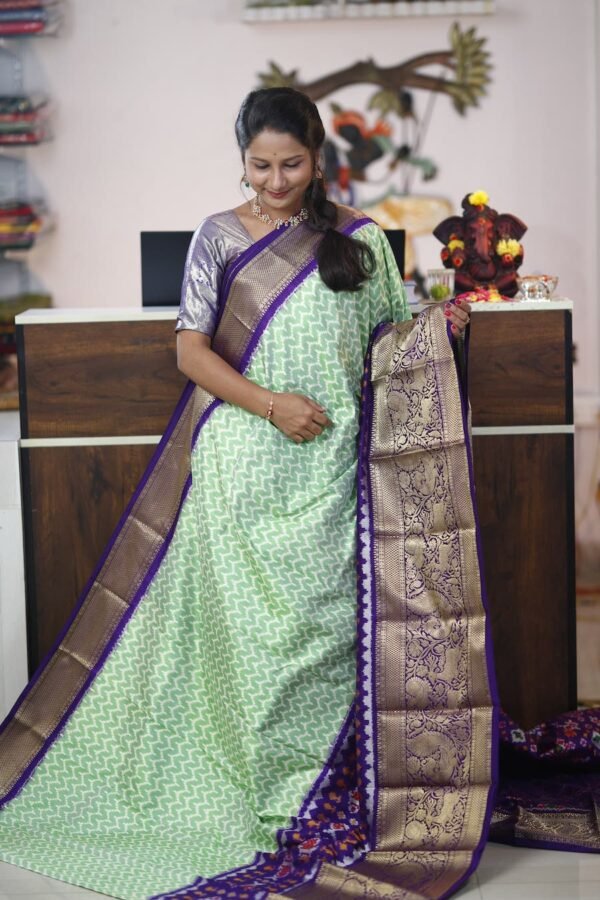 Pochampally Twill ikkat silk saree with green & purple kanchi border