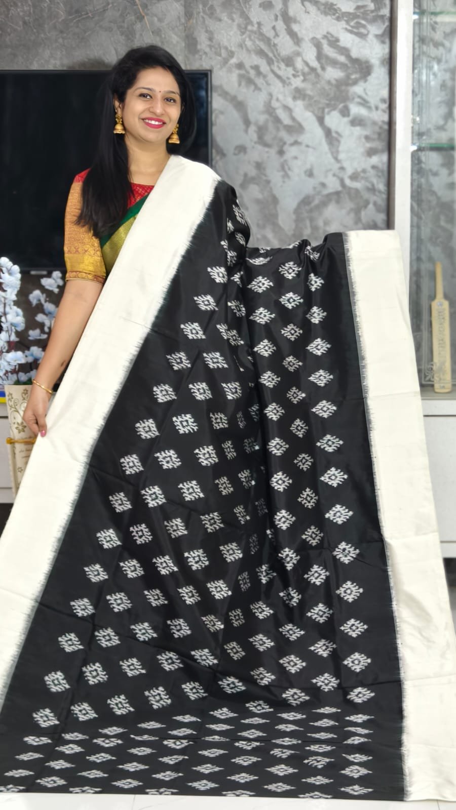 Black Pochampally silk saree with white border & ikkat patterns