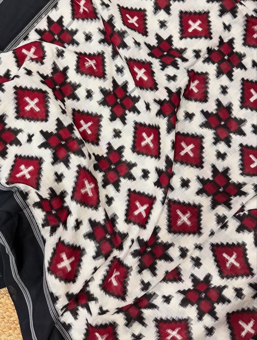white, black, red telia rumal ikkat sari closeup