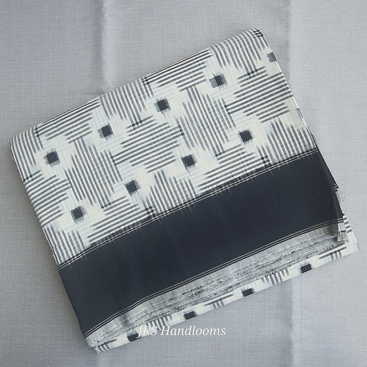 cotton double ikat saree head shot showcasing saree body & border